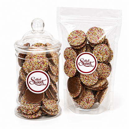 Jar and packaging of chocolate buttons retro sweets with 'Solihull Sweetshop' label on a white background