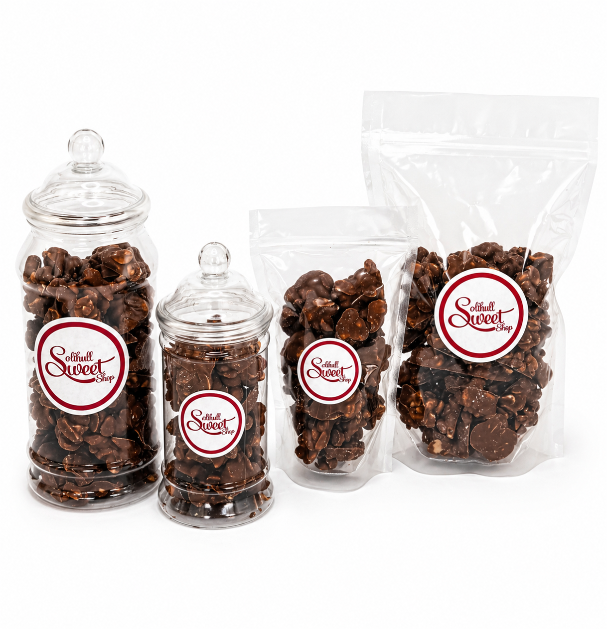 Clear jars and bags filled with chocolate-covered peanuts retro sweets, featuring a visible brand label Solihull Sweetshop